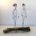 Wire Sculpture. Titled: The French Sisters. Mounted on Driftwood with details made from Seashells. Mixed Media Sculpture.