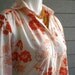vintage 70s secretary blouse with orange flowers. size medium.