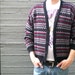 vintage cardigan sweater with zigzag stripe in black, grey, & red.