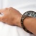 Handmade green hued bronze filigree bracelet. Unique vertical flat design