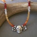 Mexican Fire Opal and silver skull necklace honoring Day of the Dead