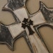 Antique white and black stacked cross