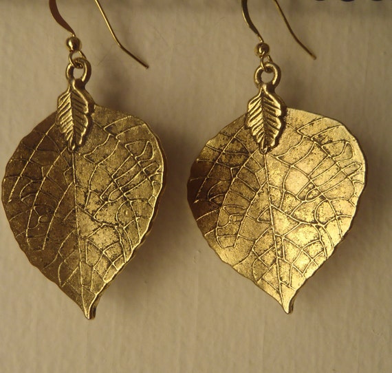 Items similar to Gold leaf earrings on Etsy