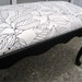 French Provincial Distressed Black Bench With Leafy Black and White Cushioned Seat