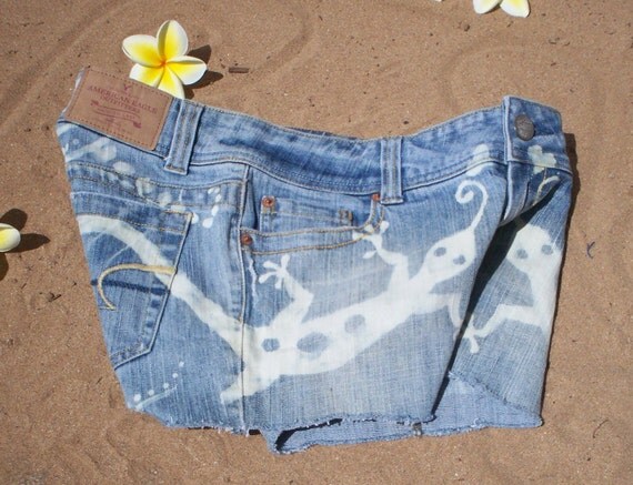 Hand bleached denim shorts with gecko design by reMusedClothing