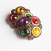 4 Vintage Antique Gold Tone Plastic Shank Buttons, with 4 Center Plastic Jewels in Yellow, Red, Green and Purple Item 0253