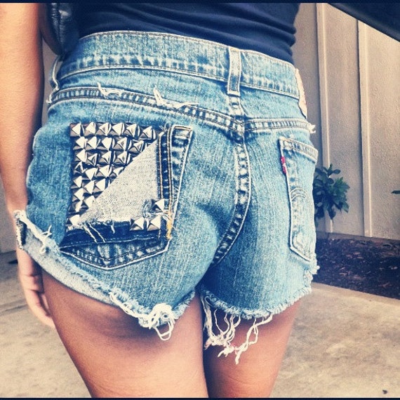 Narrow Choices A pair of black high waisted shorts combined with a set of dazzling white fishnets with sparkling studs to emphasize her shapely gams. Black booties with a sky-high heel added several inches to.