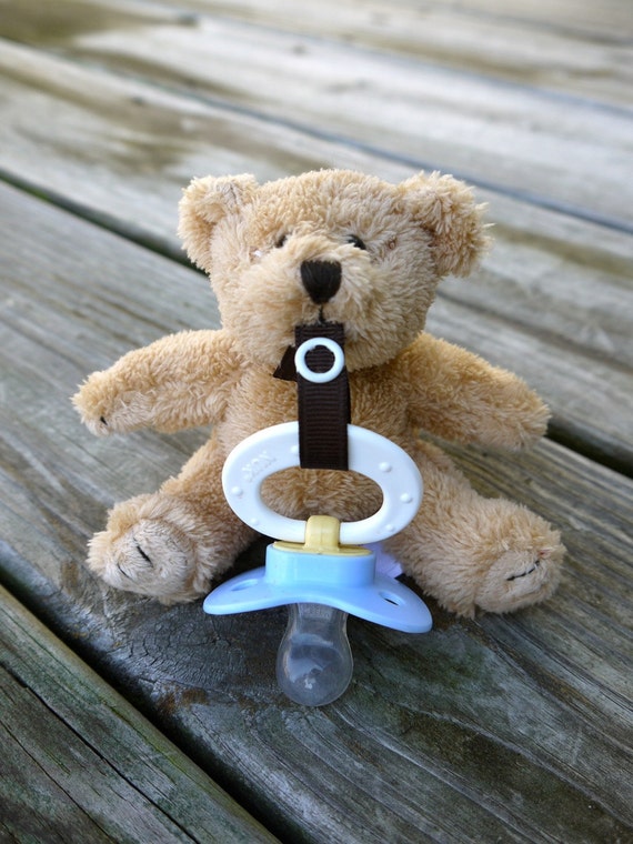 stuffed bear with pacifier