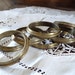 S: 8 FRENCH CURTAIN RINGS, Brass Curtain Rings in original Patina.