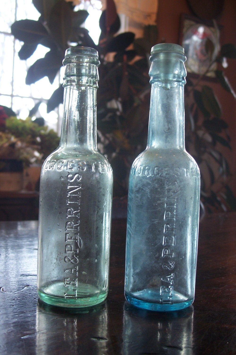 Two antique glass Lea & Perrins Worcestershire Sauce bottles
