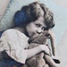 Delightful Coloured Real Photographic Postcard of a Young Girl Cuddling Toy Elephant