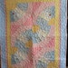 Baby Quilt with a vintage feel. Original Fan pattern using vintage reproduction prints with lady bugs and polka dots