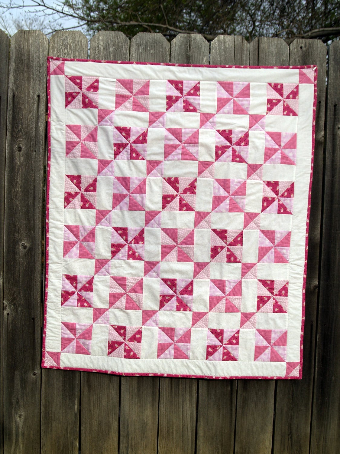 pink-baby-quilt-in-vintage-pinwheel-pattern