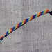 Friendship bracelet in rainbow colors with beads