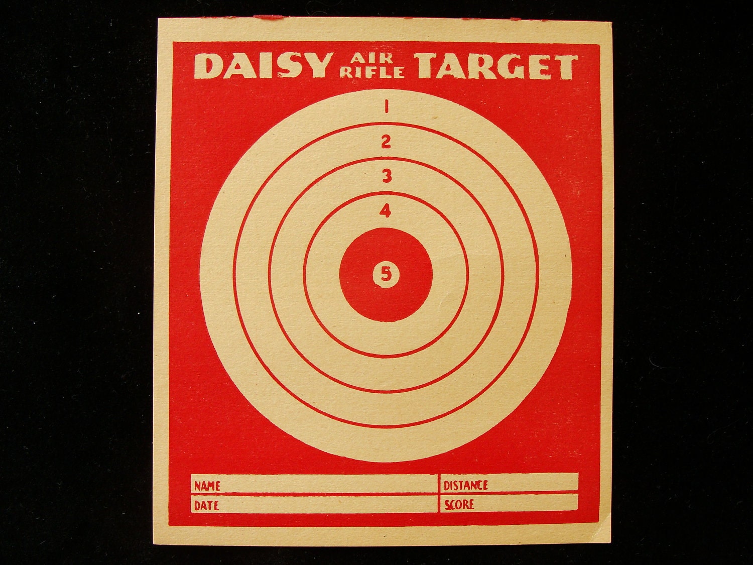vintage daisy air rifle target with ad on back