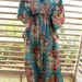 Light blue cotton kaftan with bouquets of pink, yellow and red flowers