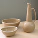 Reserved for Kowal A collection of Gunnar Nylund's mid-century modern stoneware in the Ritzi pattern: a pitcher and two bowls ABL-098