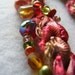 Textile Art Knitted Necklace silk boucle melon, steel grey and gold, beaded.