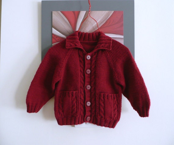Hand knitted red baby cardigan with cables & pockets fit 9-12