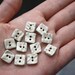 12 buttons: square white textured ceramic - 3/8 inch 10mm