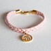 Braided light pink suede bracelet with gold plated Allah swt enamel pendant