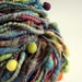 Handspun and dyed merino wool / yarn- beehive coils- deep greens, blues, plum and brown-funky felt balls