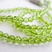 Peridot Rondelles, AAA, Half Strand, 2.5-3.25mm, 8 inches