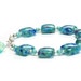 Ocean Blue and Violet Beaded Bracelet with Turquoise Lily Charm - Lampwork Glass Beads - Handmade Jewelry