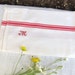 Vintage French red striped tea towel with monogram M