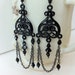 Gothic inspired black earrings with crystals, chain, and filigree piece