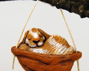 Sleeping lop eared rabbit ornament