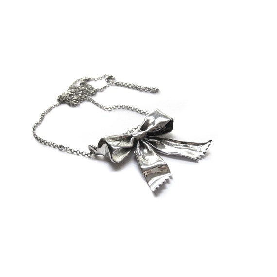 Items similar to big ribbon bow pendant on Etsy