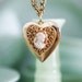 vintage golden heart locket with cameo