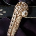 handmade abstract faux-ivory pendant--- Armed Star