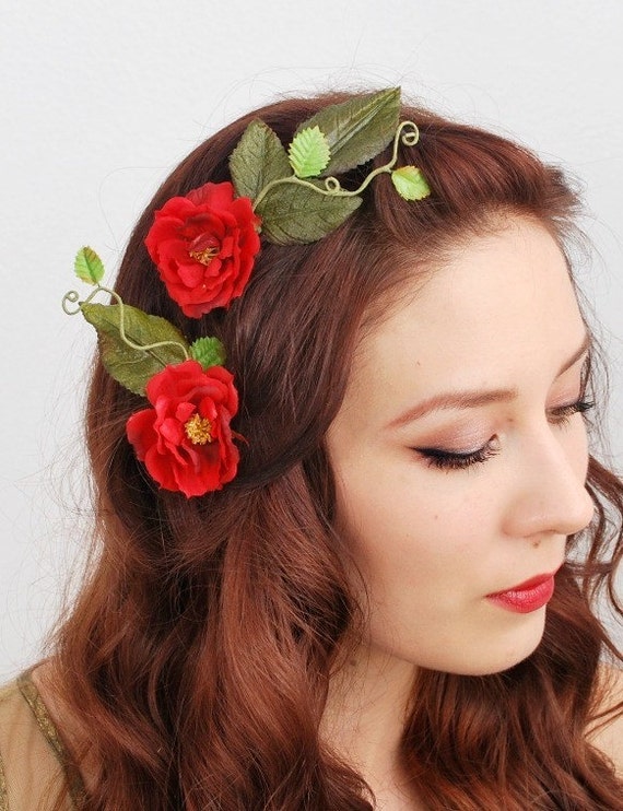 Shop by category These red rose hair clips will add class to any outfit. The 2 flowers are attached to a hairdresser style clip and has glitter edging. Simply slide into hair for a secure fit.