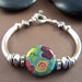 Makayla Bracelet - Artisan Glass Bead with Sterling Silver Curved Tube Bracelet