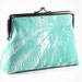 Green purse with palm tree