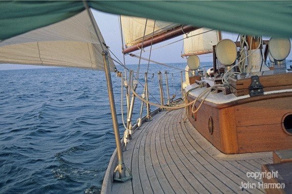 on the beam classic wooden sailboat under sail on lake erie