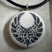 Phoenix Wings Design hand carved on a polymer clay white shimmer color background. Pendant with a FREE 3mm Necklace