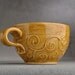 Slip Trailed Mug Ready To Ship Amber Stoneware Slip Trailed Mug by Symmetrical Pottery