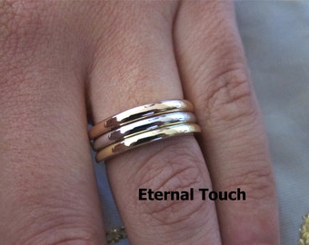 18k three tone wedding band.