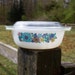 Milk glass bowl by Schott Mainz Jena Glas with blue and purple flowers and glass lid