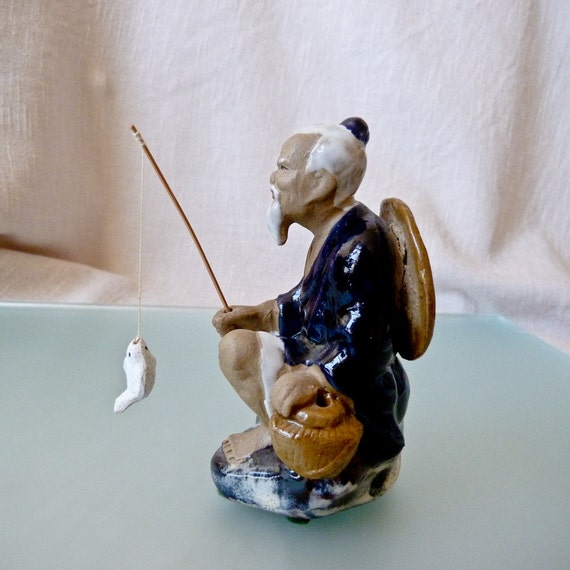 ceramic fisherman figurines