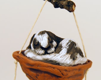 Sleeping lop eared rabbit ornament