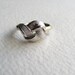 Silver knot geometric cocktail ring, adjustable, signed by Avon