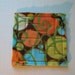 Marble Maze Game with brown, orange, blue and green circles