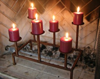 Metal Candle Holder Tabletop Sculpture / Fireplace Insert This is a custom made tabletop candle holder / sculpture with a copper patina. This piece can also be used as a fireplace insert and has a modern organic vibe that really speaks for itself. This piece is made to order so it may vary slightly from the pict