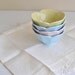 Four Pastel Ceramic Lotus Bowls in Pink Blue and Yellow