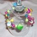 TOY STORY 3 chunky charm bracelet - trixie buttercup dolly lotso, peas and other funky beads charms - OOAK