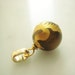 0.75 Inch Carved Phoenix on Tiger Eye with 22K Gold Round Parcel of One Pendant Item No. 6653